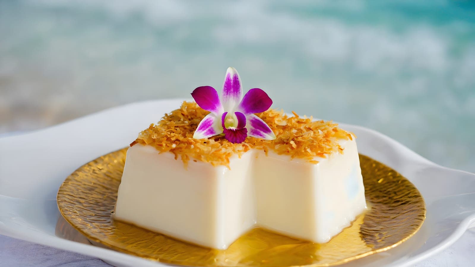 Squares of haupia — traditional Hawaiian coconut pudding — served on a plate