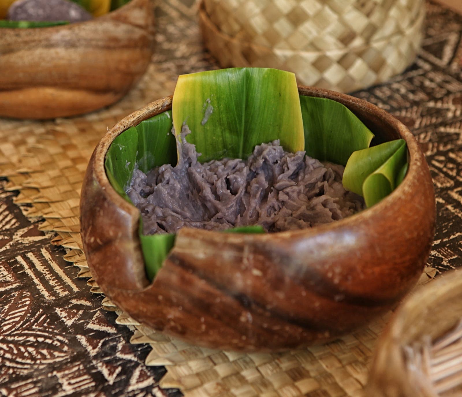 A bowl of traditional Hawaiian poi — smooth, lavender-grey fermented taro paste