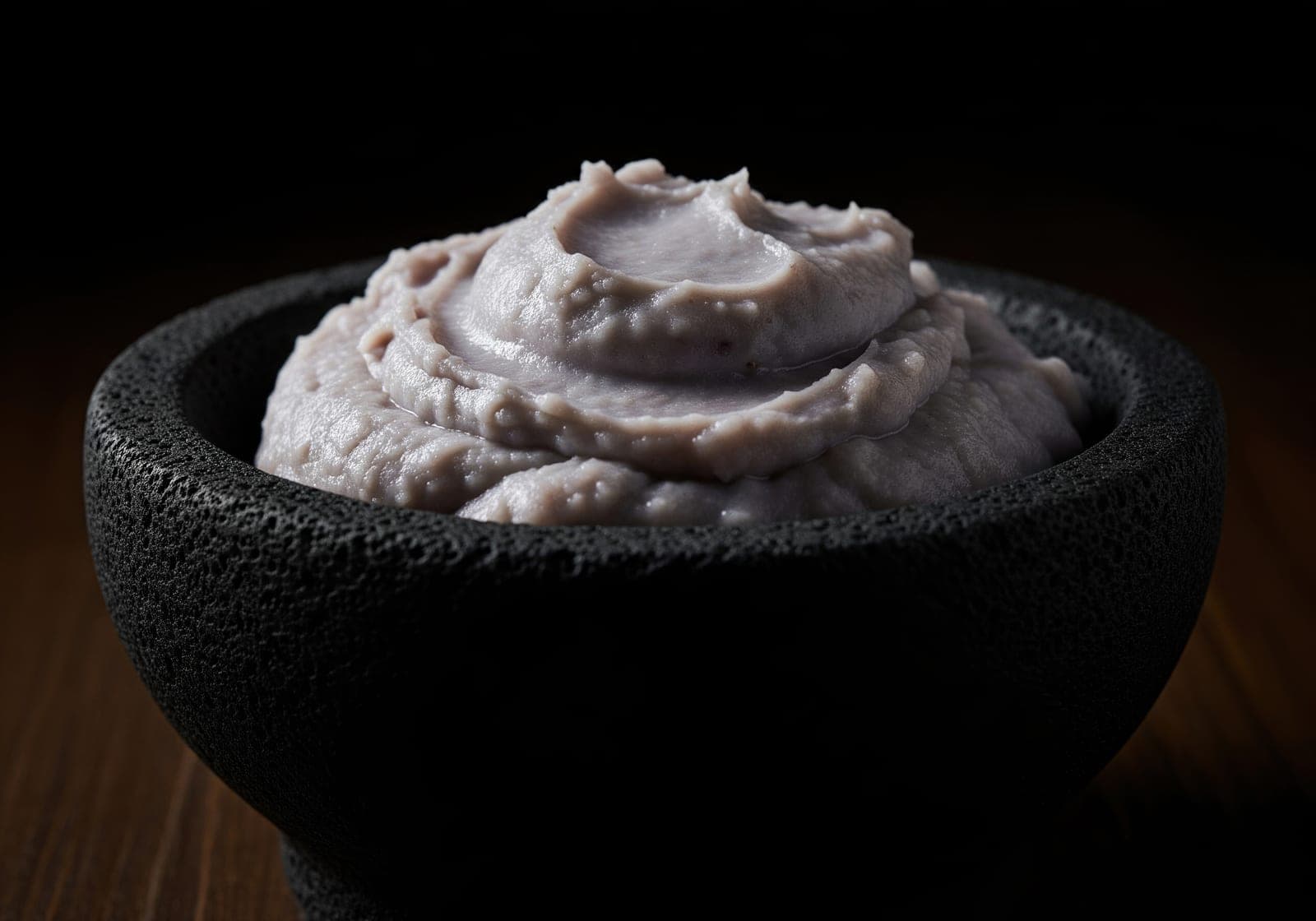 Mashed taro served in a bowl, garnished and ready to eat